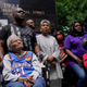 Tulsa race massacre survivors Viola Fletcher, left, and Lessie Benningfield Randle, right, listen during a rally marking centennial commemorations of a two-day assault by armed white men on Tulsa’s prosperous Black community of Greenwood, Friday, May 28, 2021, in Tulsa, Okla.